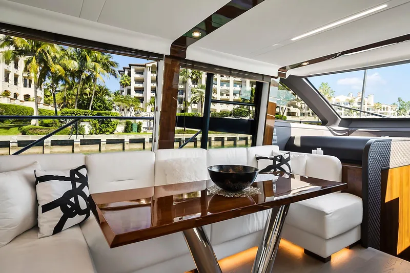 Slide: The Image of Luxurious interior of 2021 Fairline Squadron 68 yacht with elegant seating and table. - 23