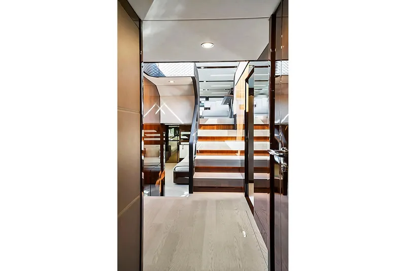 Slide: The Image of Interior view of 2021 Fairline Squadron 68 yacht, featuring modern staircase and luxurious design. - 28