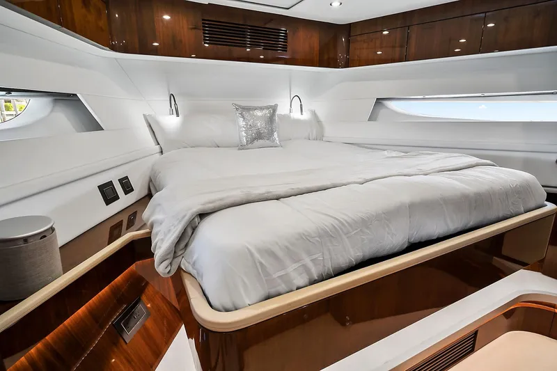 Slide: The Image of Luxurious bedroom interior of 2021 Fairline Squadron 68 yacht with elegant wood finishes. - 31