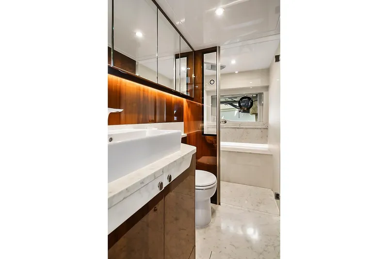 Slide: The Image of Luxurious bathroom in 2021 Fairline Squadron 68 yacht with marble and wood finishes. - 38
