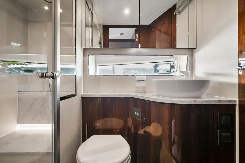 Slide: The Image of Luxurious bathroom in 2021 Fairline Squadron 68 yacht with modern fixtures and elegant design. - 41