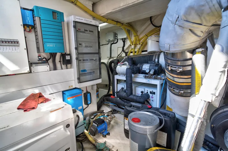 Slide: The Image of Engine room of 2021 Fairline Squadron 68 yacht, featuring electrical panels and machinery. - 45
