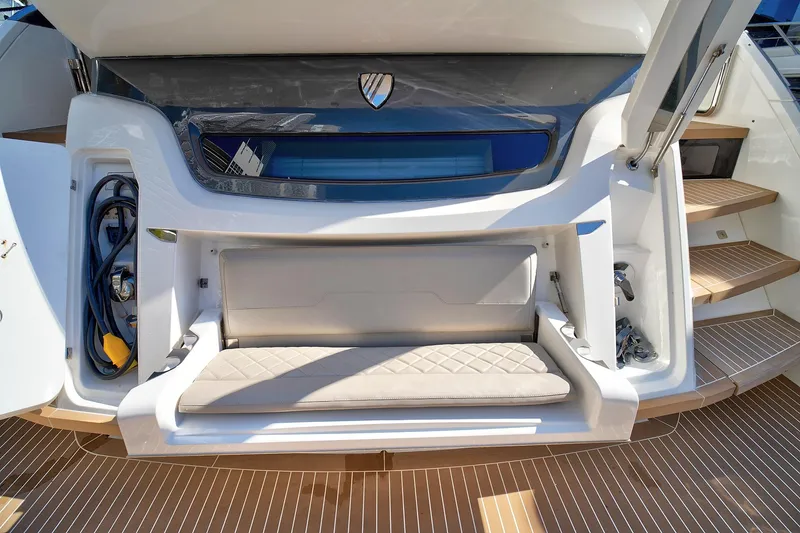 Slide: The Image of 2021 Fairline Squadron 68 yacht stern with seating and storage compartments. - 48
