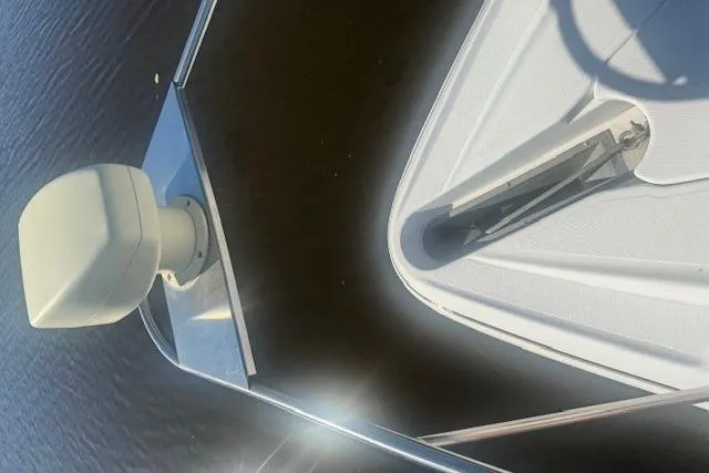 Slide: The Image of 2001 Cruisers Yachts 3672 Express boat bow with radar, on calm water. - 32