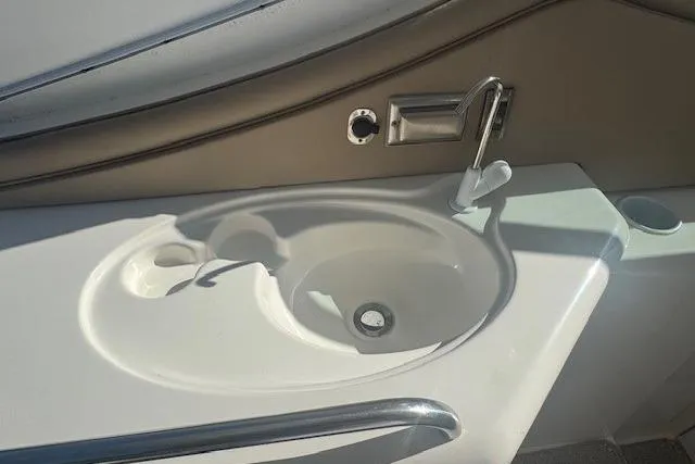 Slide: The Image of 2001 Cruisers Yachts 3672 Express boat sink with faucet and countertop. - 9