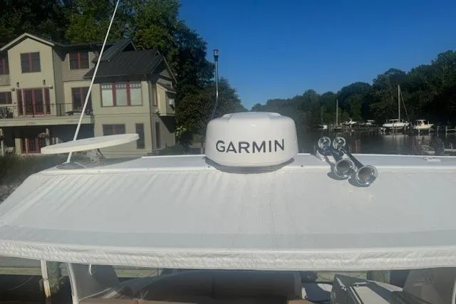 Slide: The Image of 2001 Cruisers Yachts 3672 Express with Garmin radar, docked near waterfront homes. - 15