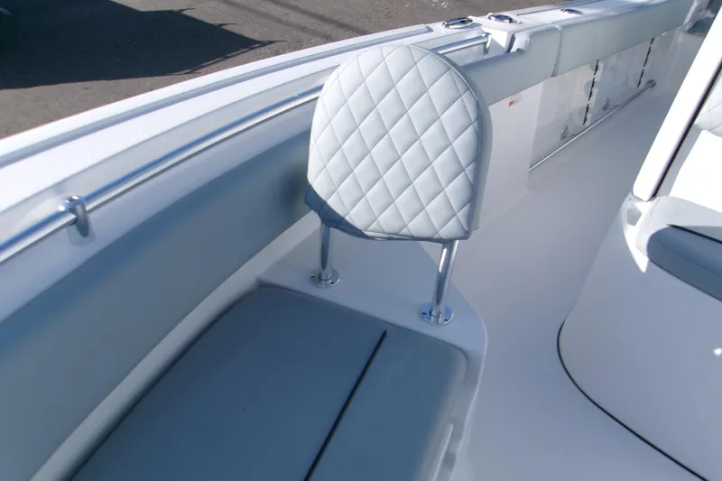 Slide: The Image of 2026 Sportsman Heritage 231 Center Console boat interior with cushioned seating. - 10