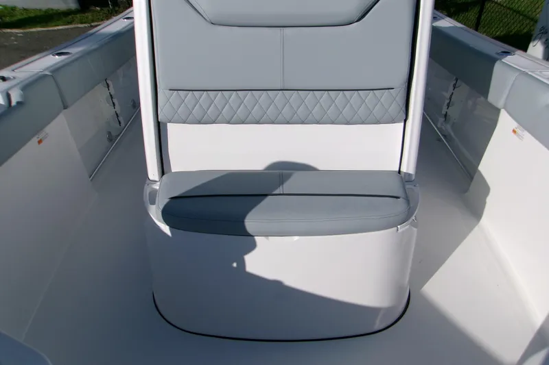 Slide: The Image of 2026 Sportsman Heritage 231 Center Console boat interior with gray cushioned seating. - 11