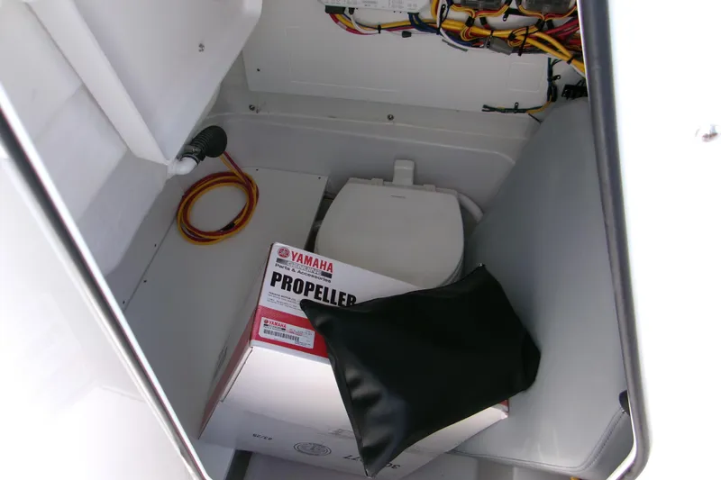 Slide: The Image of Storage compartment in 2026 Sportsman Heritage 231 Center Console with Yamaha propeller box. - 13