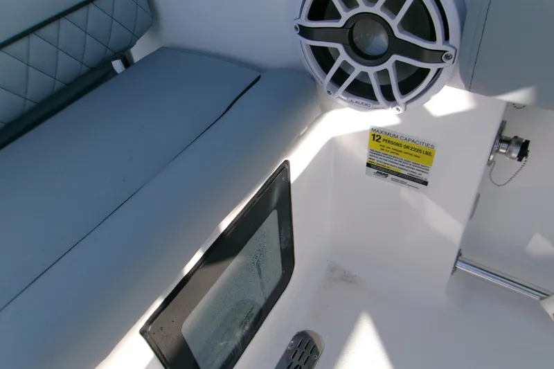 Slide: The Image of 2026 Sportsman Heritage 231 Center Console interior with speaker and capacity label. - 16