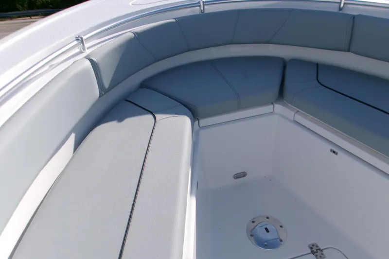 Slide: The Image of 2026 Sportsman Heritage 231 Center Console boat interior with cushioned seating. - 9