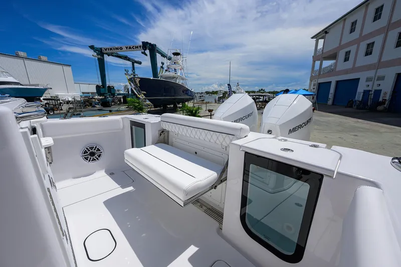 Slide: The Image of 2026 Sportsman Open 262 Center Console boat with Mercury engines at a marina. - 17