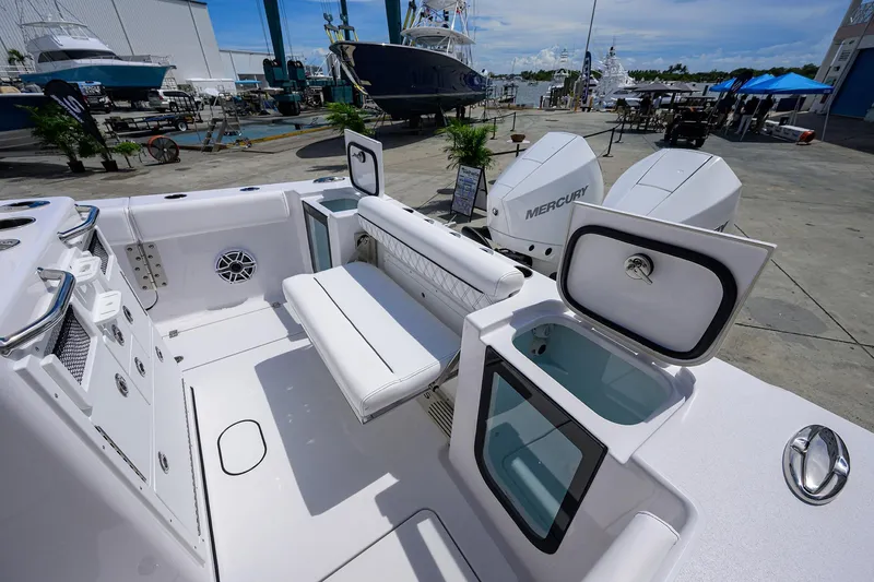 Slide: The Image of 2026 Sportsman Open 262 Center Console boat interior with seating and storage compartments. - 18