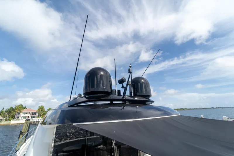 Slide: The Image of 2009 Lazzara LSX 75 yacht with antennas against a blue sky backdrop. - 20