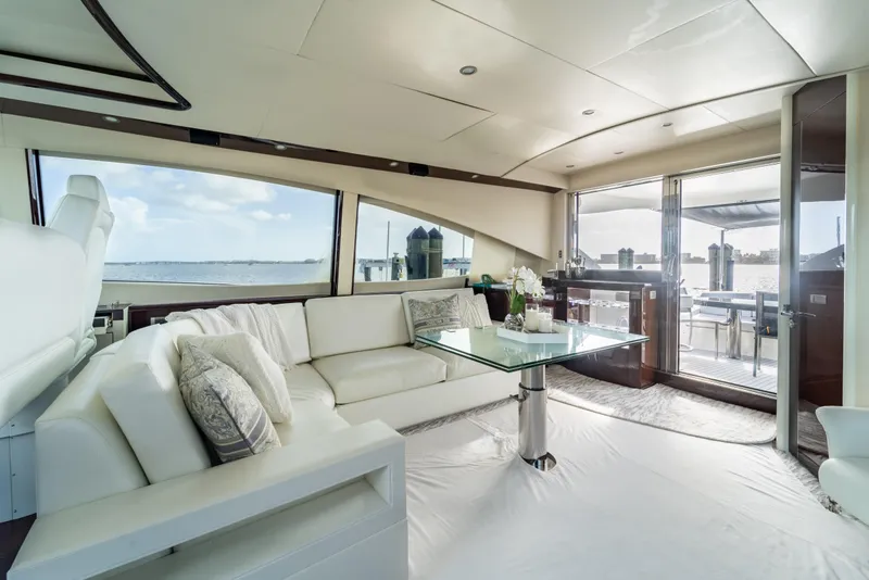 Slide: The Image of Luxurious interior of 2009 Lazzara LSX 75 yacht with elegant seating and glass table. - 22