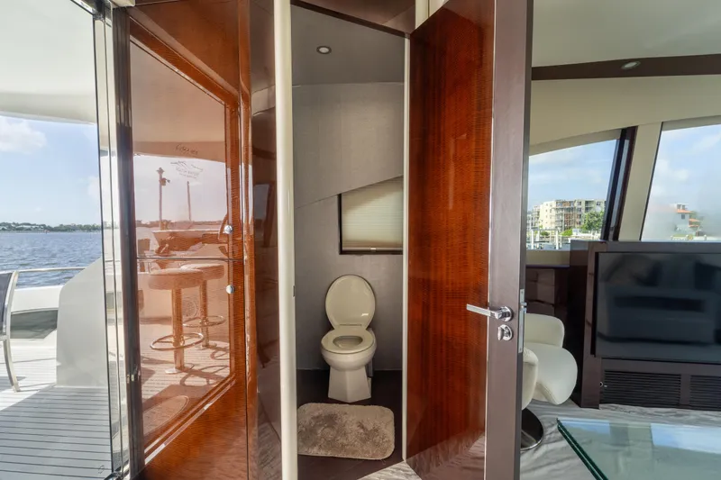 Slide: The Image of Luxurious 2009 Lazzara LSX 75 yacht interior with modern bathroom and scenic water view. - 23