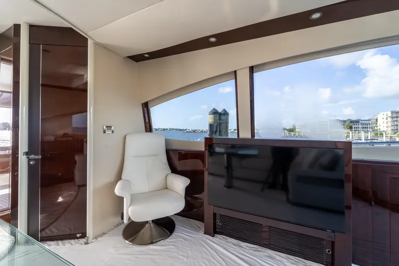 Slide: The Image of Luxurious interior of 2009 Lazzara LSX 75 yacht with white chair and large TV. - 25