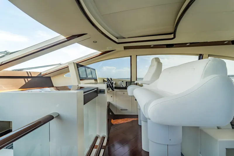 Slide: The Image of Interior of 2009 Lazzara LSX 75 yacht with modern helm and white seating. - 26