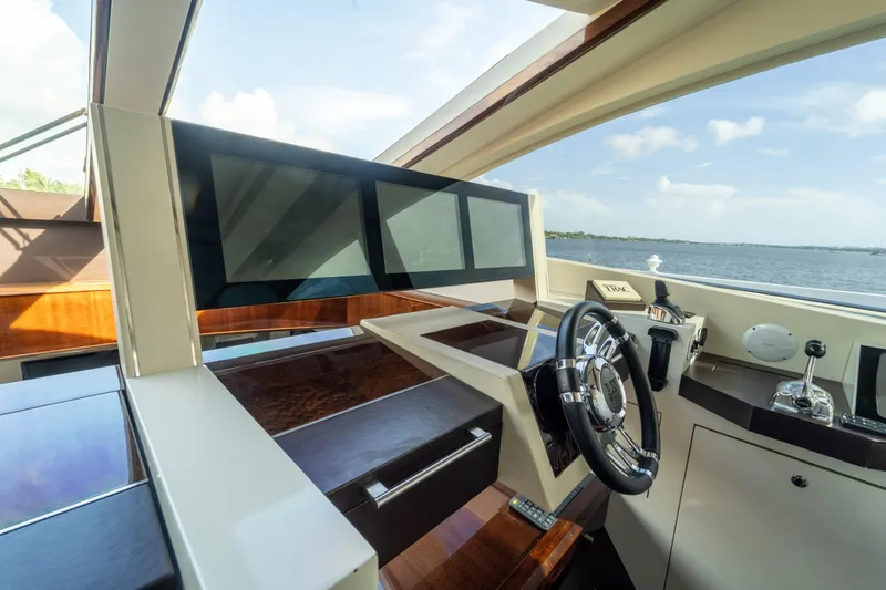 Slide: The Image of Luxurious 2009 Lazzara LSX 75 yacht helm with modern controls and scenic ocean view. - 27