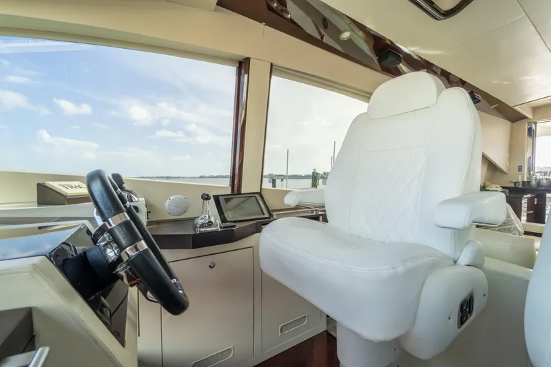 Slide: The Image of Luxurious helm of 2009 Lazzara LSX 75 yacht with plush white captain's chair. - 28