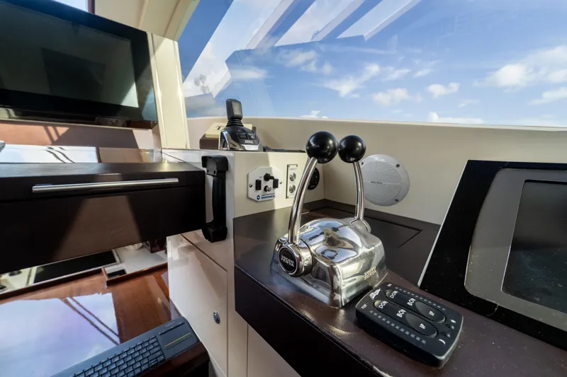 Slide: The Image of Control panel of a 2009 Lazzara LSX 75 yacht with modern navigation equipment. - 29