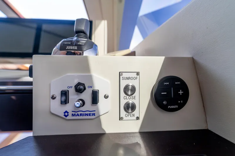 Slide: The Image of Control panel on 2009 Lazzara LSX 75 yacht with sunroof and audio controls. - 35