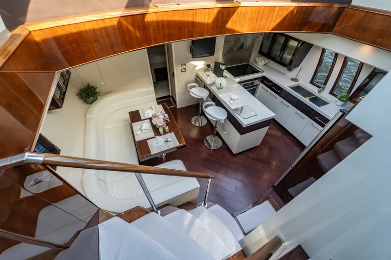 Slide: The Image of Luxurious interior of 2009 Lazzara LSX 75 yacht with modern kitchen and seating area. - 36