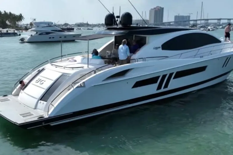 Slide: The Image of 2009 Lazzara LSX 75 yacht cruising in a marina with people on board. - 4