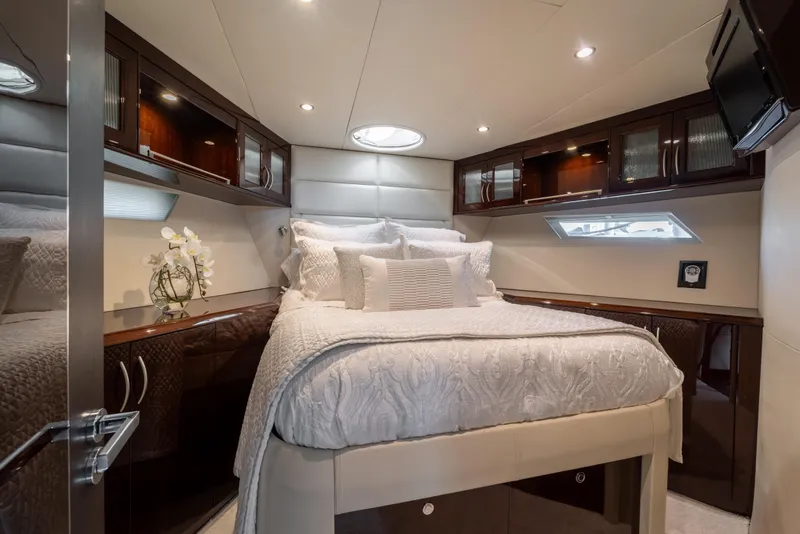 Slide: The Image of Luxurious bedroom interior of 2009 Lazzara LSX 75 yacht with elegant bedding and wood cabinetry. - 44