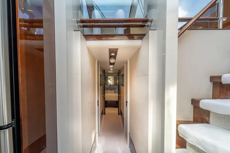 Slide: The Image of Interior hallway of 2009 Lazzara LSX 75 yacht with modern design and wooden accents. - 48
