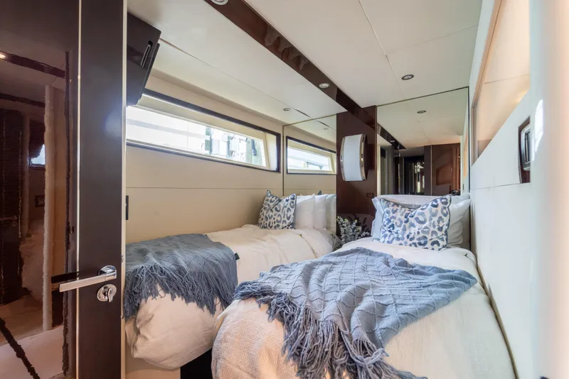 Slide: The Image of Luxurious twin bedroom in 2009 Lazzara LSX 75 yacht with elegant decor and natural light. - 49