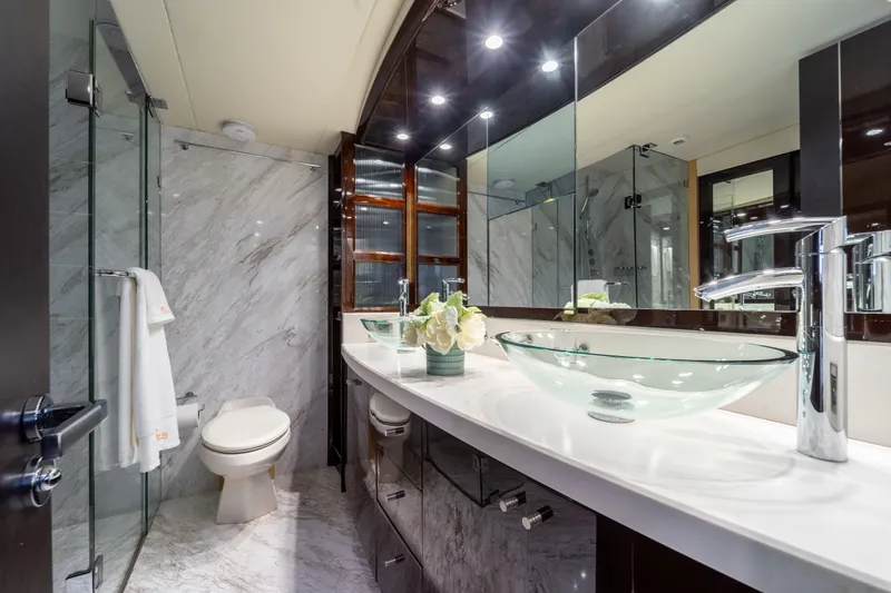 Slide: The Image of Luxurious bathroom in 2009 Lazzara LSX 75 yacht with glass sink and marble decor. - 57