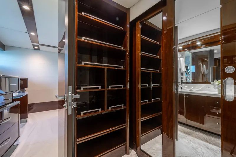 Slide: The Image of Luxurious interior of 2009 Lazzara LSX 75 yacht featuring elegant wood cabinetry and modern bathroom. - 59