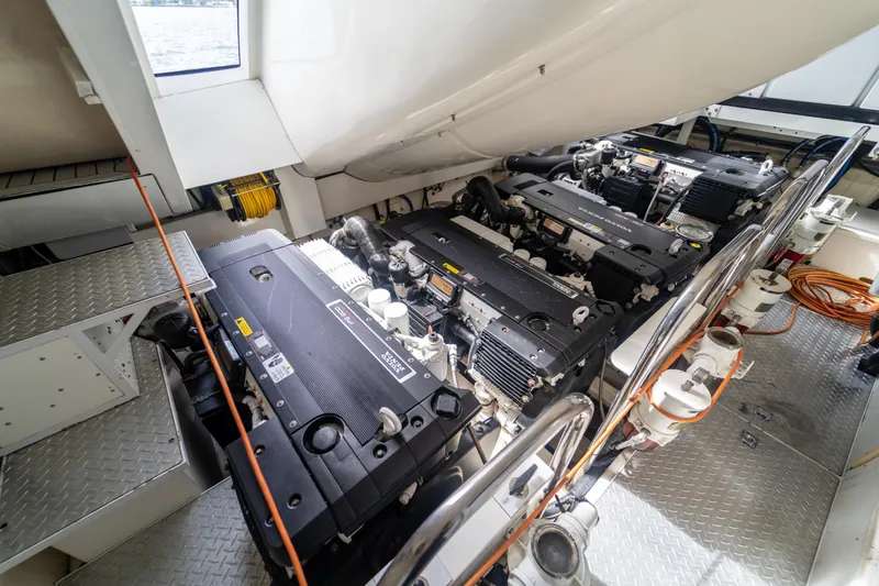 Slide: The Image of Engine room of 2009 Lazzara LSX 75 yacht with multiple engines and equipment. - 69