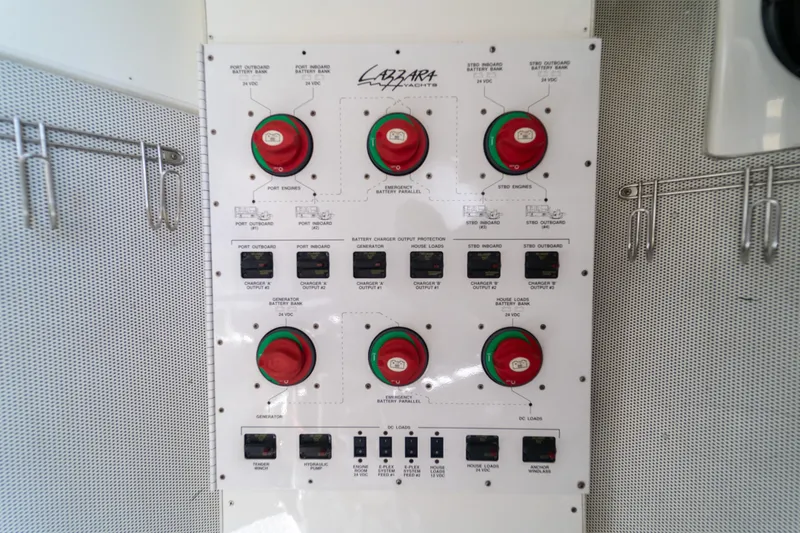 Slide: The Image of Control panel of a 2009 Lazzara LSX 75 yacht, featuring battery switches and indicators. - 70