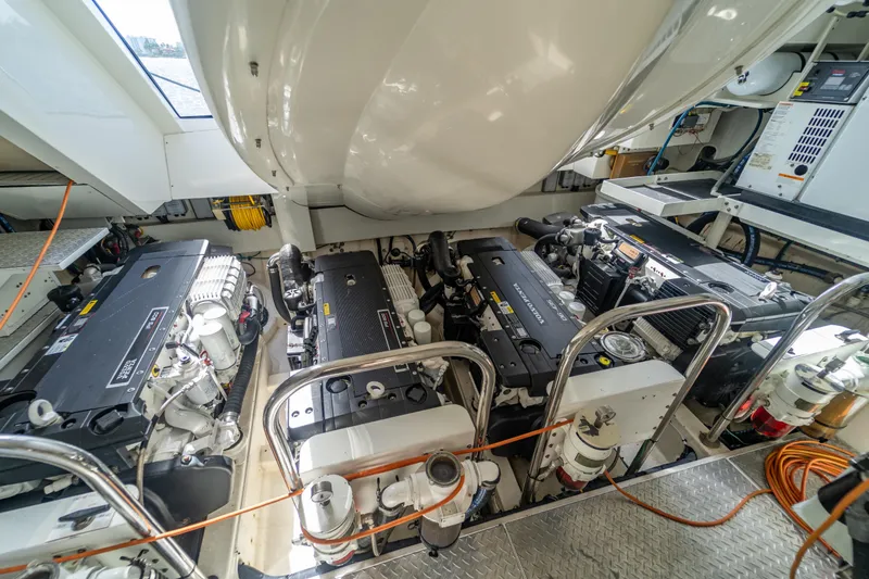 Slide: The Image of Engine room of 2009 Lazzara LSX 75 yacht with multiple engines and equipment. - 77
