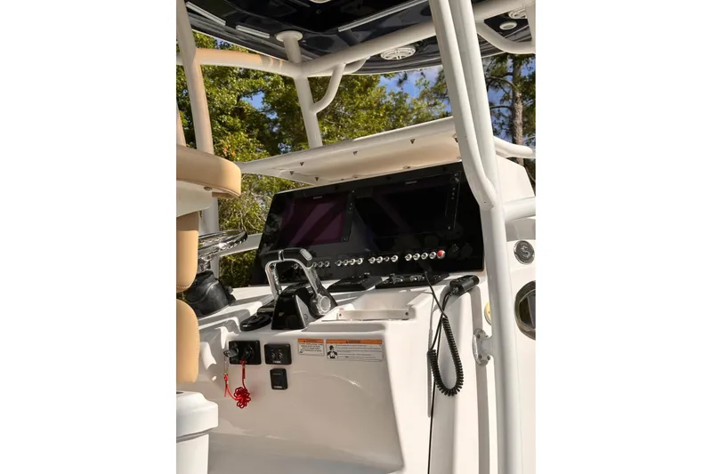 Slide: The Image of 2018 Sportsman Open 252 Center Console dashboard with modern controls and navigation equipment. - 6