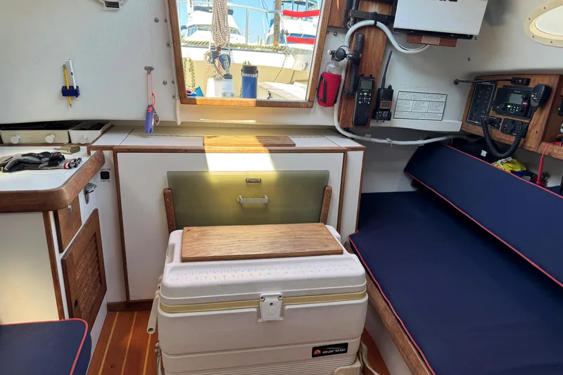 Slide: The Image of Interior of a 2006 Alerion Express 28 sailboat with navigation equipment and seating. - 12