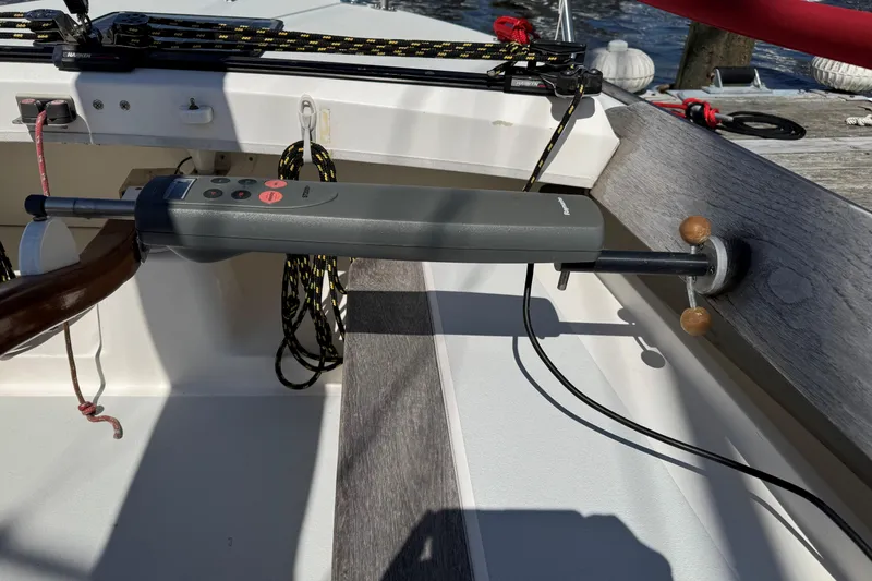 Slide: The Image of Autopilot system on a 2006 Alerion Express 28 sailboat, docked with ropes visible. - 2