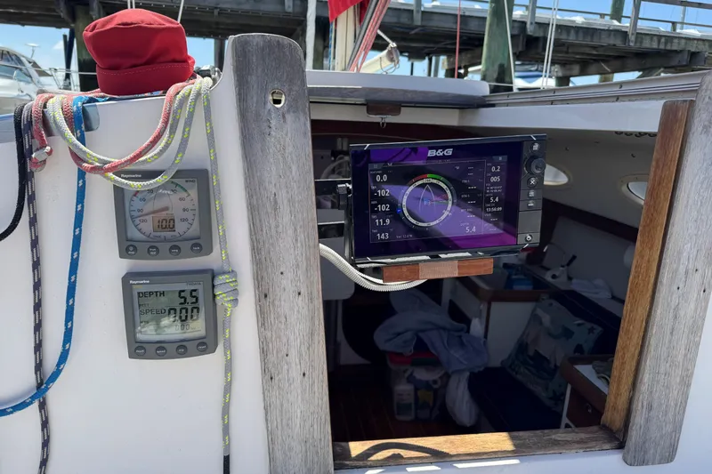 Slide: The Image of Cockpit of 2006 Alerion Express 28 sailboat with navigation instruments and ropes. - 4