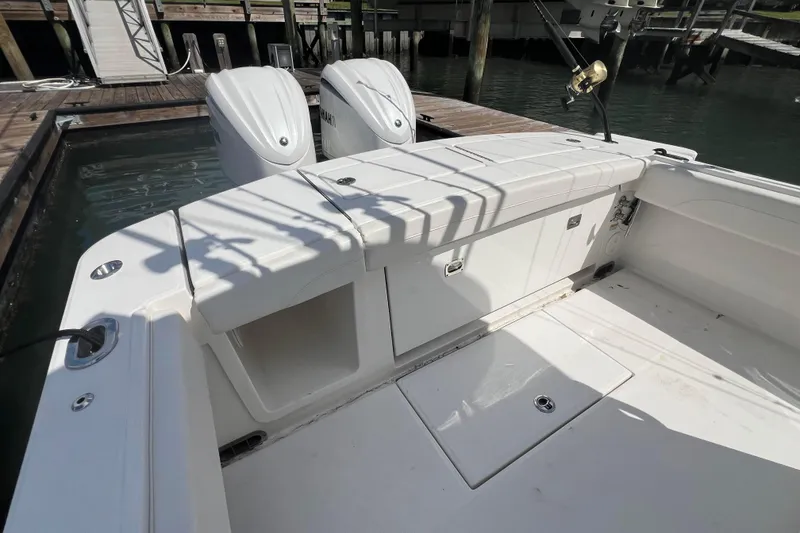 Slide: The Image of 2025 Regulator 28 boat with dual engines docked at marina. - 10