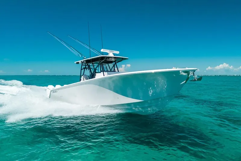 The Image of 2024 SeaHunter 39 Tournament boat cruising on clear turquoise waters. - 0