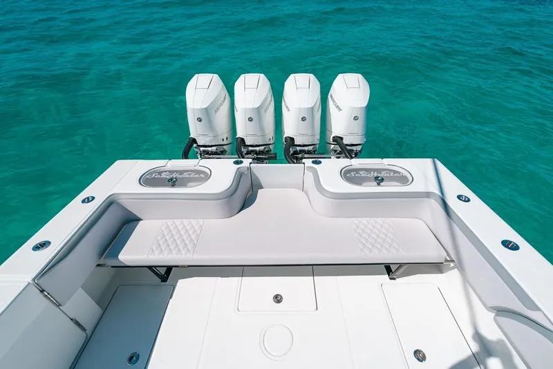 Slide: The Image of 2024 SeaHunter 39 Tournament boat with four outboard engines on turquoise water. - 16