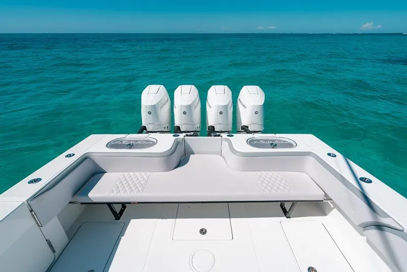 Slide: The Image of 2024 SeaHunter 39 Tournament boat with four outboard engines on clear blue water. - 18