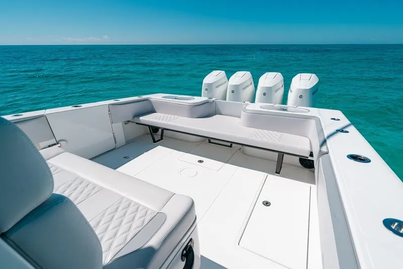 Slide: The Image of 2024 SeaHunter 39 Tournament boat interior with seating and multiple outboard engines. - 19