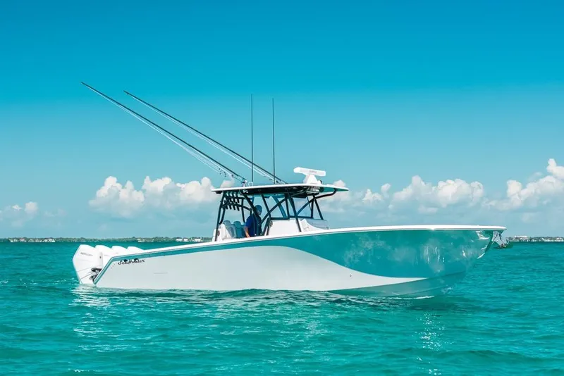 Slide: The Image of 2024 SeaHunter 39 Tournament boat on turquoise water under clear blue sky. - 2