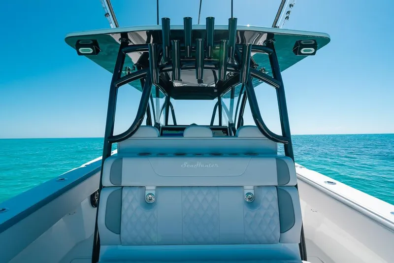 Slide: The Image of 2024 SeaHunter 39 Tournament boat interior with ocean view, featuring sleek seating and modern design. - 22
