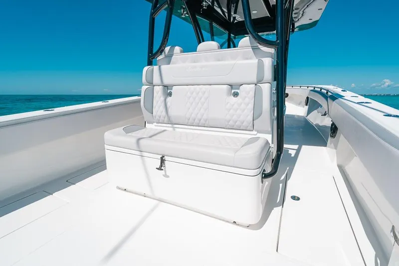 Slide: The Image of 2024 SeaHunter 39 Tournament boat interior with white seating and ocean backdrop. - 23