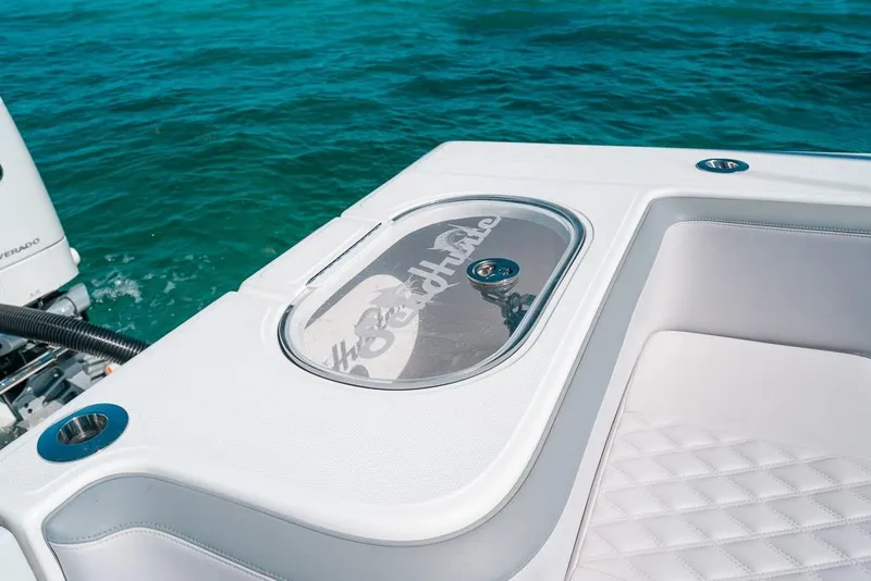 Slide: The Image of 2024 SeaHunter 39 Tournament boat with sleek seating and ocean backdrop. - 25