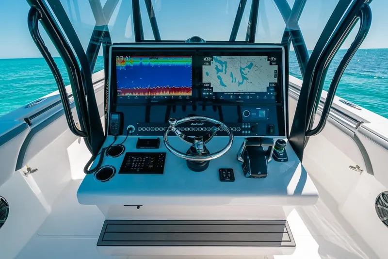 Slide: The Image of 2024 SeaHunter 39 Tournament boat dashboard with advanced navigation and control systems. - 28